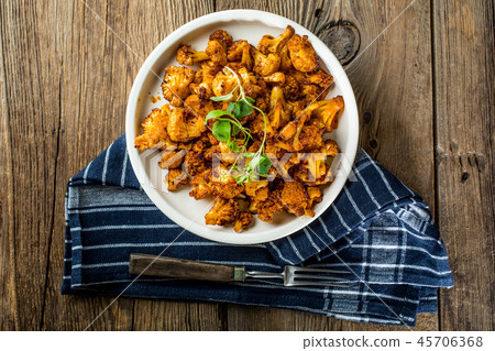 Cauliflower rosettes in a herbal marinade. 45706368