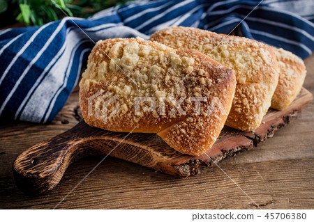 Sweet buns with cheese on wooden table. Sweet buns with cheese on wooden table. 45706380