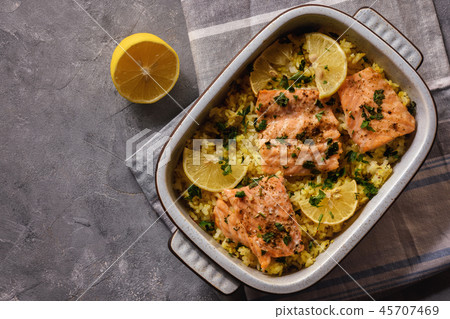 Salmon baked on oven with rice and lemon. Salmon baked on oven with rice and lemon. 45707469