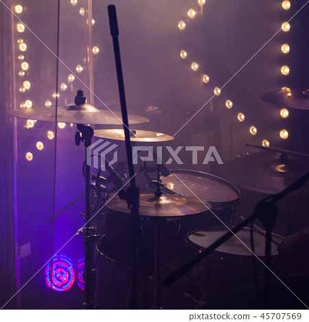 Cymbals in stage lights. Close-up square photo 45707569