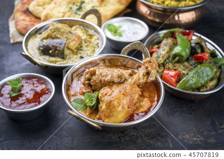 Traditional Indian Curries and Biryani with Mango  45707819