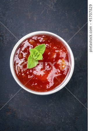 Traditional Indian Mango Chutney as close-up in a Traditional Indian Mango Chutney as close-up in a 45707829