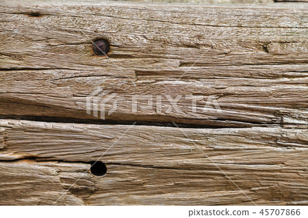 Old wooden board with rusty nail holes Old wooden board with rusty nail holes 45707866