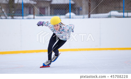 Speed skating young girl on training rink Speed skating young girl on training rink 45708228