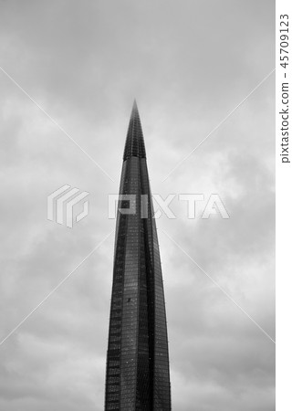 Skyscraper on cloud sky background. 45709123
