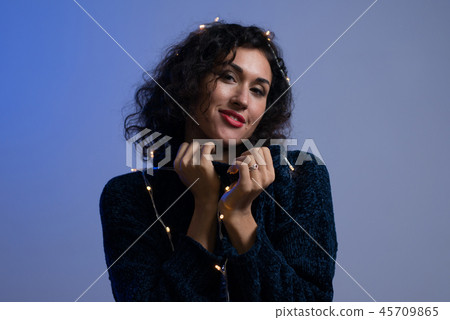 Young woman with xmas glowing lights Celebration, Christmas, New Year, Birthday Young woman with xmas glowing lights Celebration, Christmas, New Year, Birthday 45709865