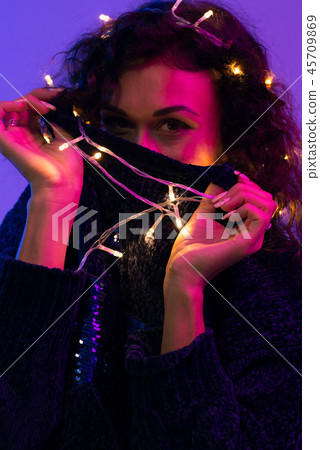 Young woman with xmas glowing lights Celebration, Christmas, New Year, Birthday Young woman with xmas glowing lights Celebration, Christmas, New Year, Birthday 45709869