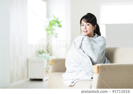 Woman chilling winter blanket living young woman 45711658