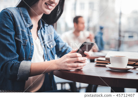 Close up of young woman that typing answer Close up of young woman that typing answer 45712407