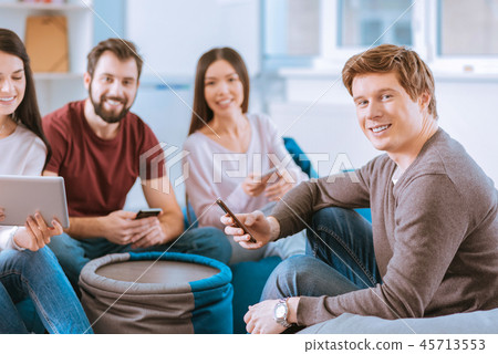 Gay four friends applying gadgets 45713553