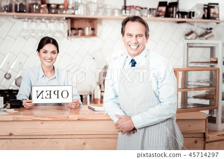 Positive joyful man greeting you 45714297