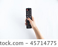 Television controller in woman hand 45714775
