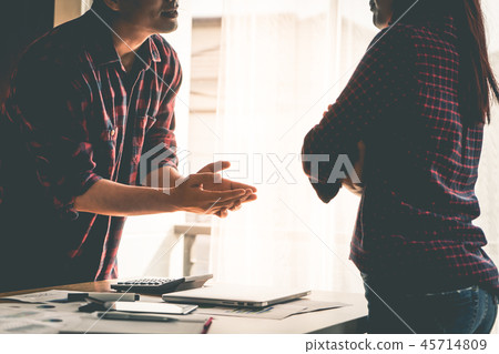 Silhouette co worker is fighting by the windows Silhouette co worker is fighting by the windows 45714809