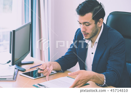Business man taking note on interview report Business man taking note on interview report 45714810