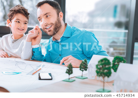 Father and son listening to the music 45714934