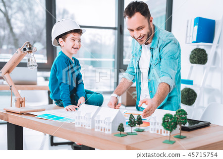 Creative father and son laughing Creative father and son laughing 45715754