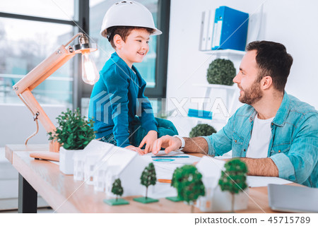 Father and a son working together on a project 45715789