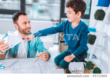 Joyful man and his child drawing together 45715805