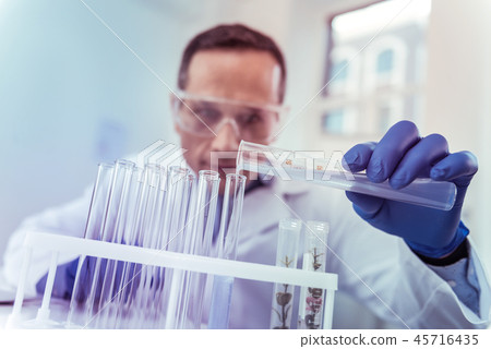 Close up of male hand that holding test tube 45716435