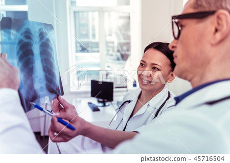 Pretty Asian doctor working with pleasure in clinic 45716504