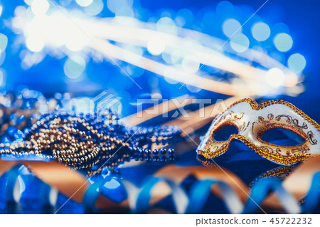 Traditional female carnival venetian mask on bokeh background. Masquerade, Venice, Mardi Gras Traditional female carnival venetian mask on bokeh background. Masquerade, Venice, Mardi Gras 45722232
