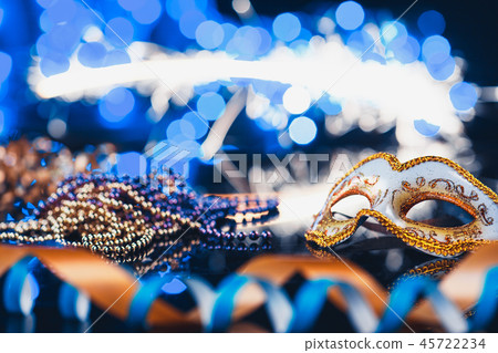 Traditional female carnival venetian mask on bokeh background. Masquerade, Venice, Mardi Gras Traditional female carnival venetian mask on bokeh background. Masquerade, Venice, Mardi Gras 45722234