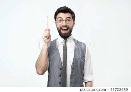 Young hispanic man with beard, glasses and pencil has a good idea. Young hispanic man with beard, glasses and pencil has a good idea. 45722689
