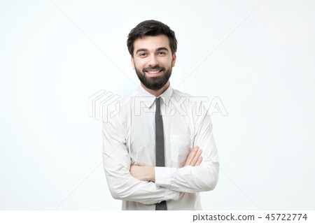 smiling man with crossed arms over gray background 45722774