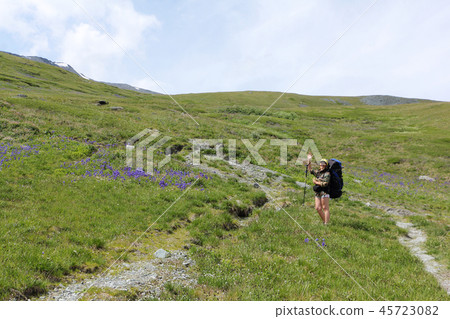 Woman climbing by Pass Kara-Turek, Altai Mountains Woman climbing by Pass Kara-Turek, Altai Mountains 45723082