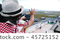 Children waving on an airplane 45725152