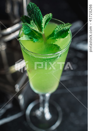 Green refreshing Alcoholic Cocktail. Mint on top 45728266