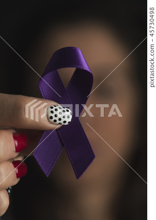 purple ribbon against the violence against women 45730498