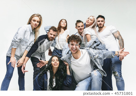 Group of smiling friends in fashionable jeans Group of smiling friends in fashionable jeans 45731801