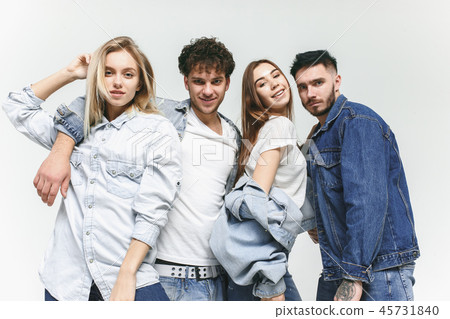 Group of smiling friends in fashionable jeans Group of smiling friends in fashionable jeans 45731840