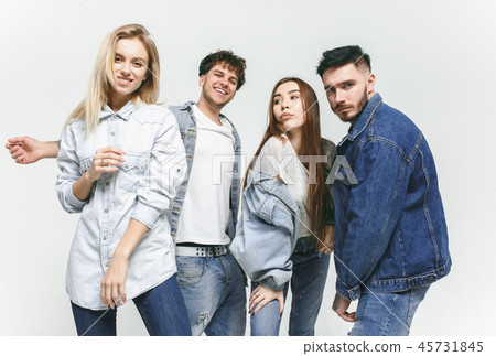 Group of smiling friends in fashionable jeans Group of smiling friends in fashionable jeans 45731845