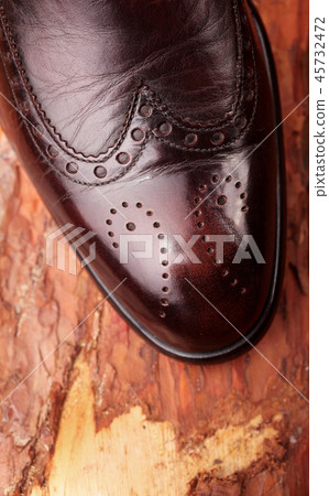 Brown leather chelsea boots polished. Closeup 45732472