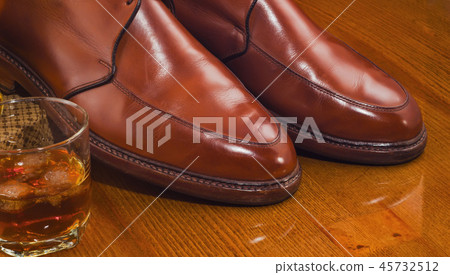 Glass of whiskey,waxing derby shoes shine Glass of whiskey,waxing derby shoes shine 45732512
