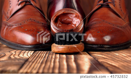 Brush and cream for shoes .Defocused shoes brogues Brush and cream for shoes .Defocused shoes brogues 45732832