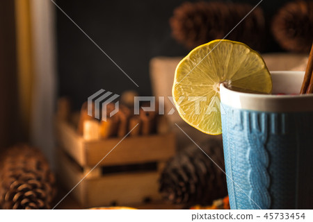 Cosy still life with hot tea, lemon and cinnamon Cosy still life with hot tea, lemon and cinnamon 45733454