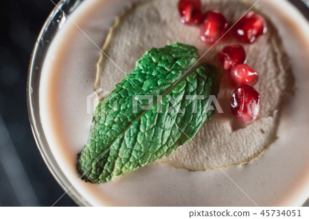 Espresso Martini cocktail, grains of pomegranate on top 45734051