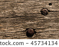 Aged wooden surface with rusty iron screws. 45734134