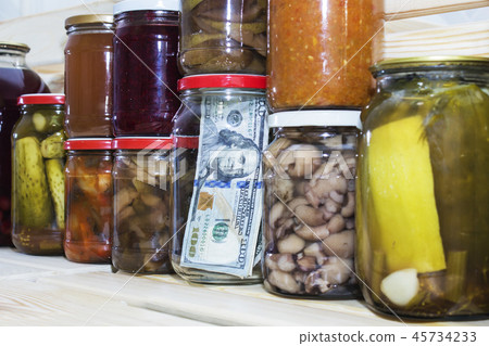 dollar in a glass jar on the background of canned dollar in a glass jar on the background of canned 45734233