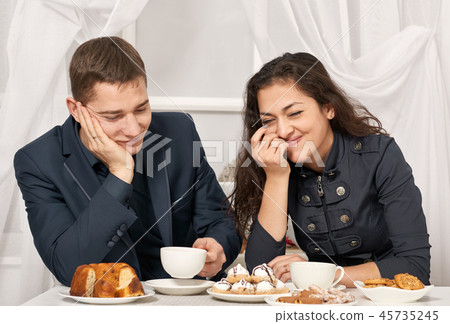 romantic couple drinking tea and talking romantic couple drinking tea and talking 45735245