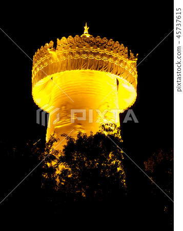 Big golden prayer wheel at night 45737615