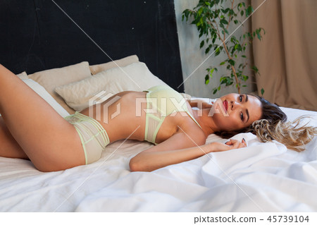 Portrait of beautiful fashionable women in underwear in the bedroom on the bed 45739104