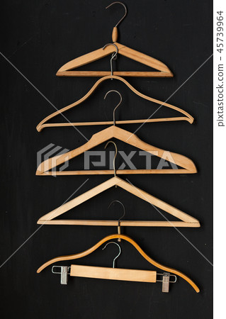 old wooden hangers for fashionable things on the background old wooden hangers for fashionable things on the background 45739964