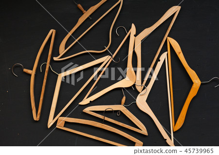 old wooden hangers for fashionable things on the background old wooden hangers for fashionable things on the background 45739965