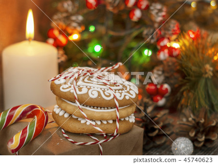 folded Christmas cookies decorated with icing  45740623