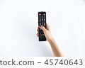 Television controller in woman hand 45740643
