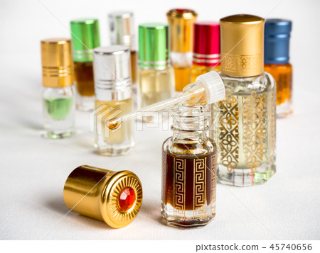 Shot of arabian oud oil in a glass jar. Shot of arabian oud oil in a glass jar. 45740656